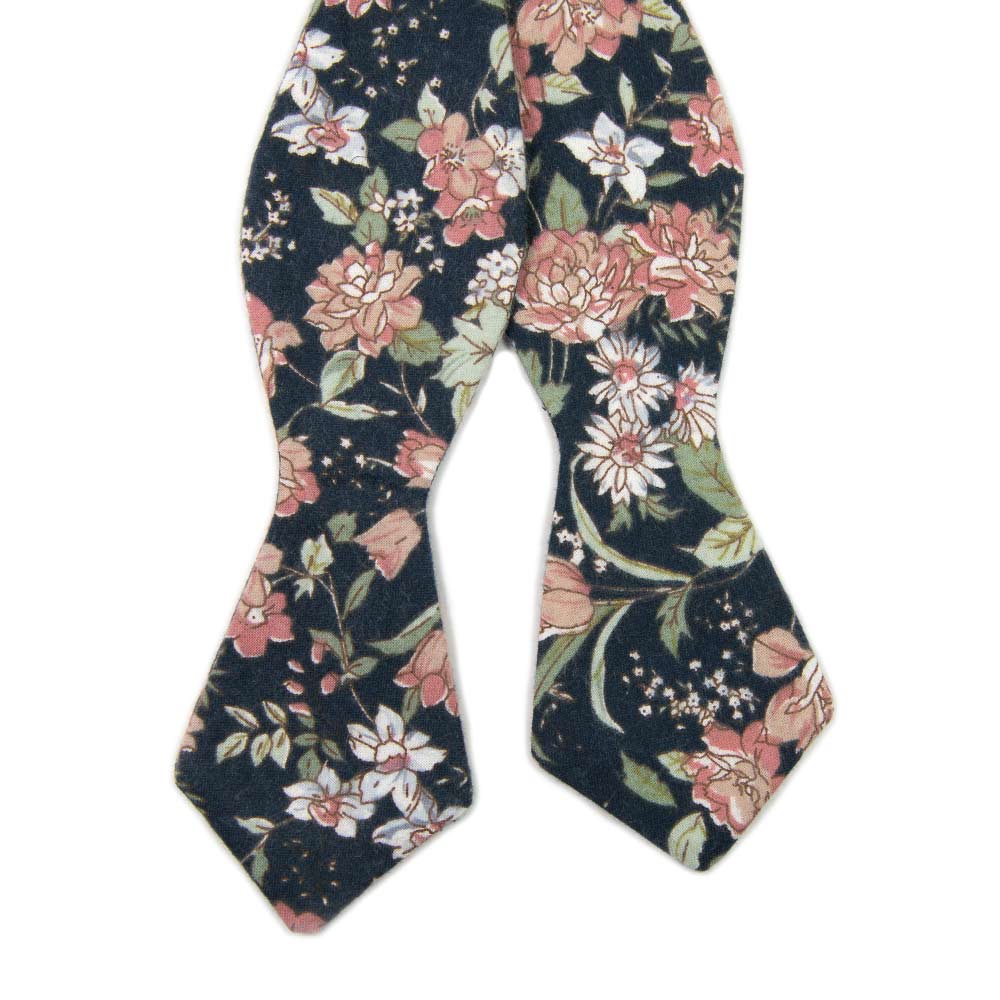 Lotus Self Tie Bow Tie. Navy background with white and blush pink flowers and sage green stems and leaves.