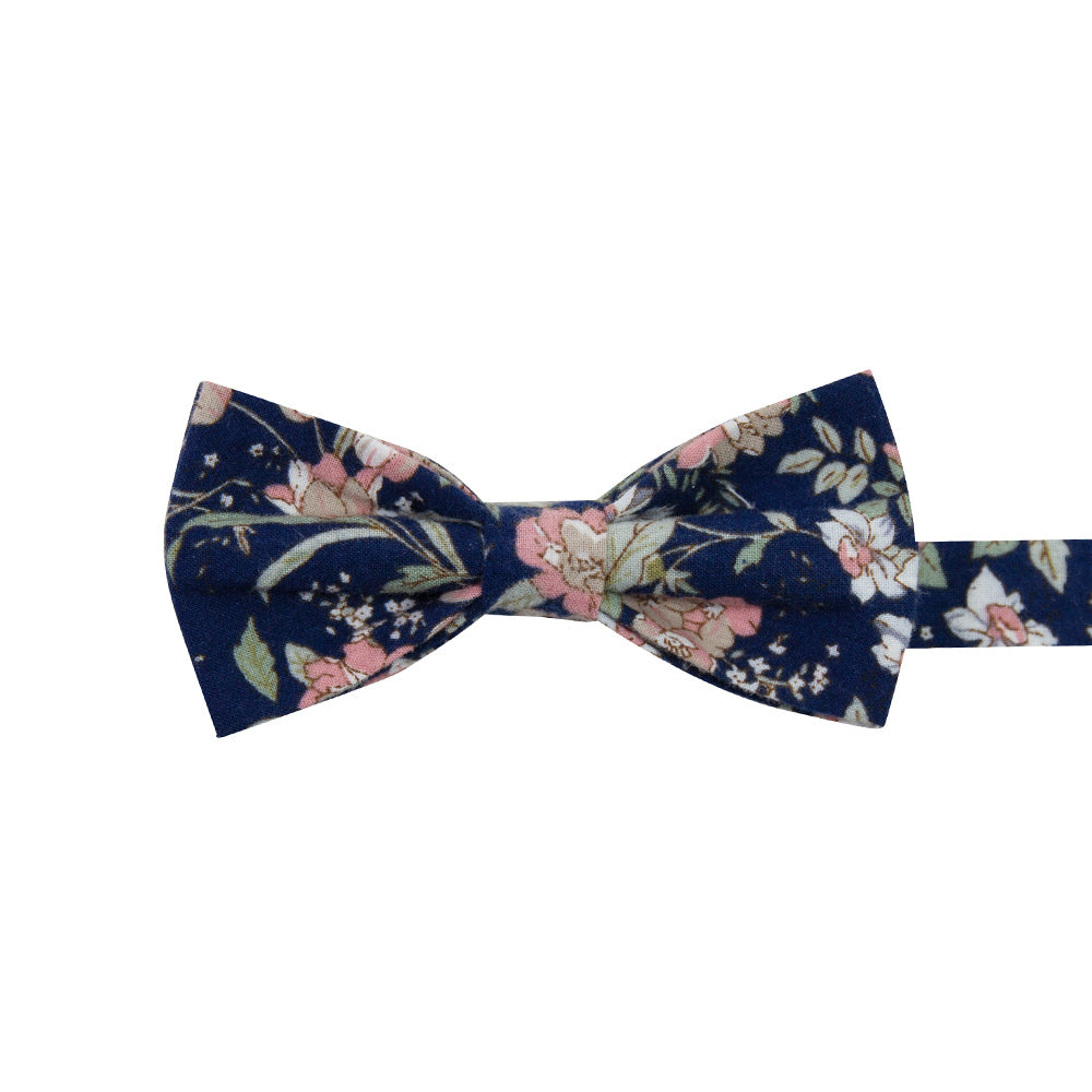 Lotus Pre-Tied Bow Tie. Navy background with white and blush pink flowers and sage green stems and leaves.