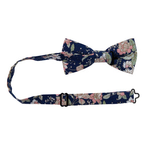 Lotus Pre-Tied Bow Tie with adjustable neck strap. Navy background with white and blush pink flowers and sage green stems and leaves.