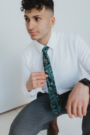 Lush Tie worn with a white shirt and gray pants.