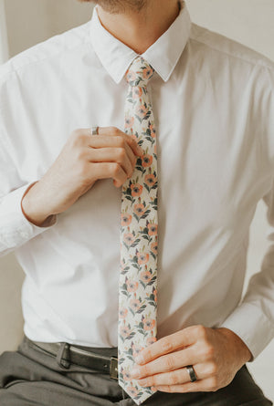 Magnolia tie worn with a white shirt, black belt and black pants.