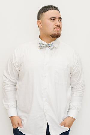 Mahalo pre-tied bow tie worn with a white shirt and blue jeans.