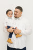 Mahalo pre-tied bow tie worn by a father and son with a white shirt and blue pants.