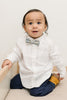 Mahalo pre-tied bow tie worn with a white shirt and blue pants, brown boots.