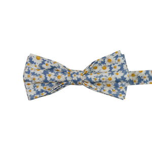 Mahalo Floral Pre-Tied Bow Tie. Dusty blue background with medium sized white and yellow daisy flowers throughout.