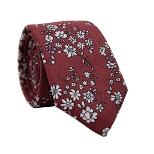 Mahogany Floral Skinny Tie. Burgundy background with small white flowers and black stems throughout.