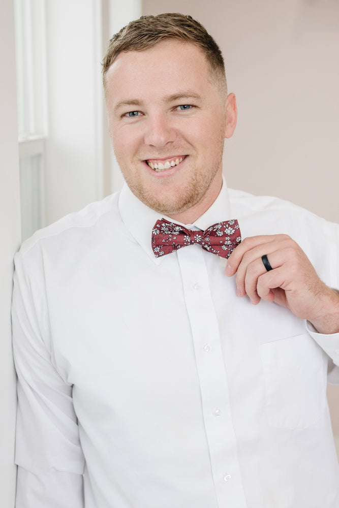 Mahogany pre-tied bow tie worn with a white shirt.