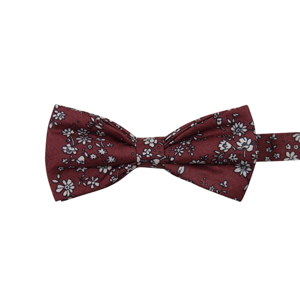 Mahogany Floral Pre-Tied Bow Tie. Burgundy background with small white flowers and black stems throughout.