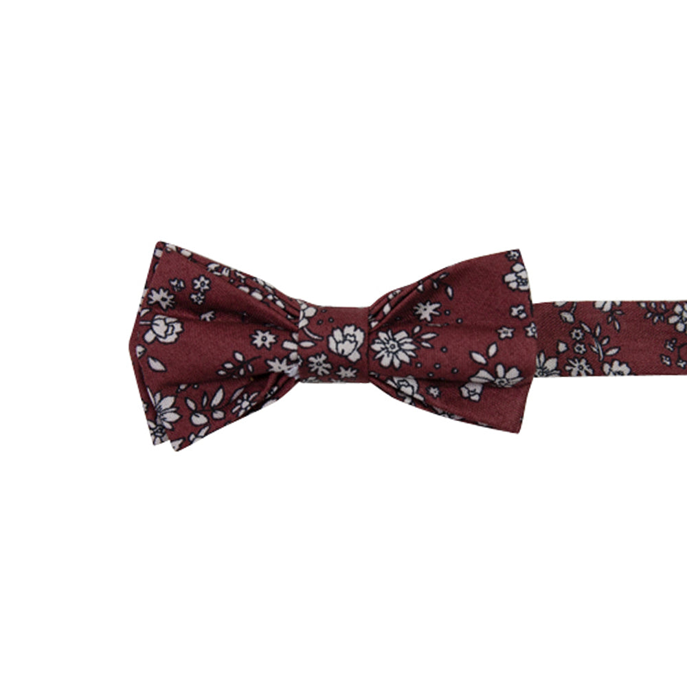 Mahogany Floral Pre-Tied Bow Tie. Burgundy background with small white flowers and black stems throughout.