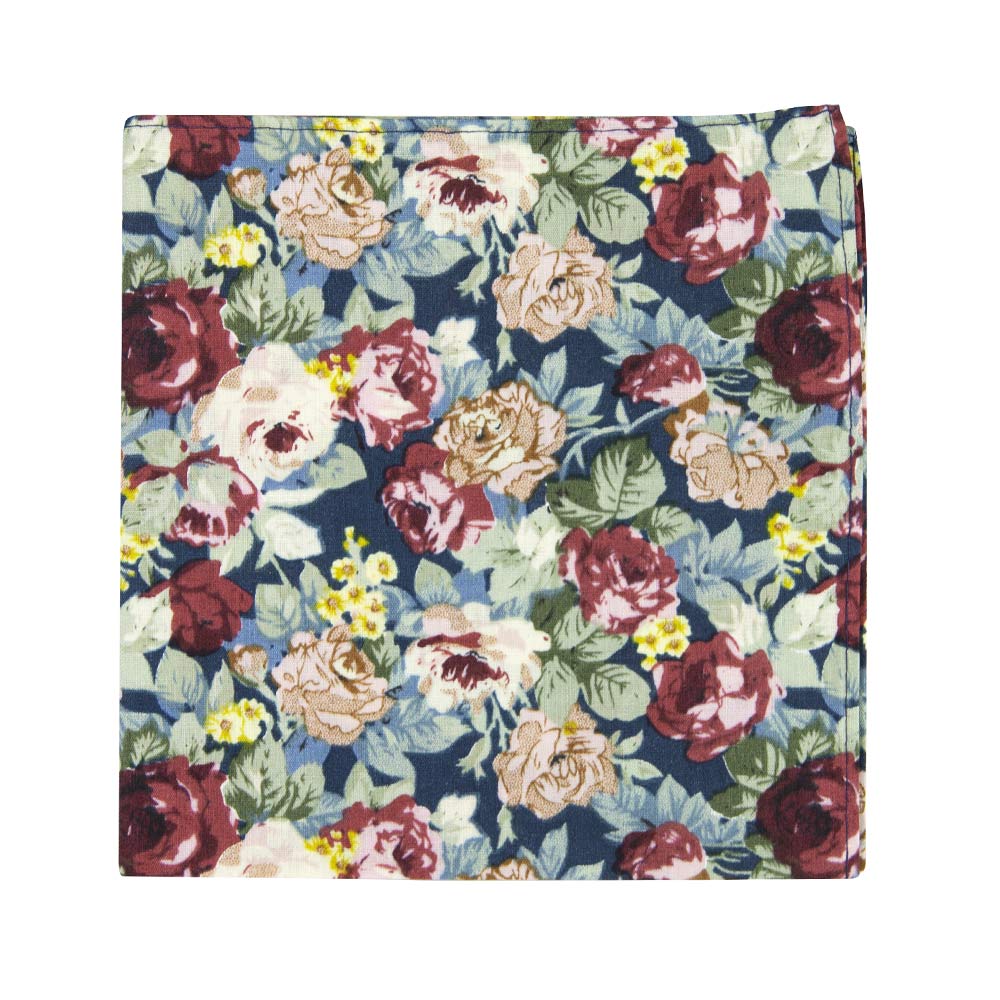 Mardi Pocket Square. Navy background with yellow, red, and cream flowers and blue leaves.