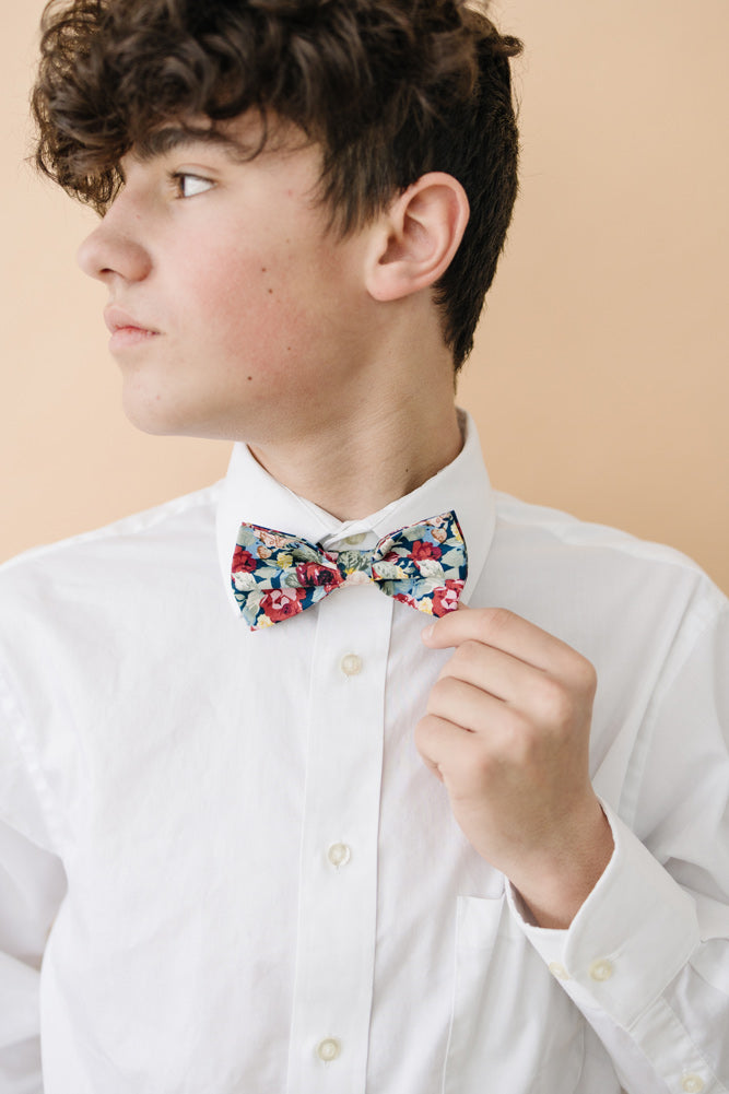 Mardi pre-tied bow tie worn with a white long sleeve shirt. 