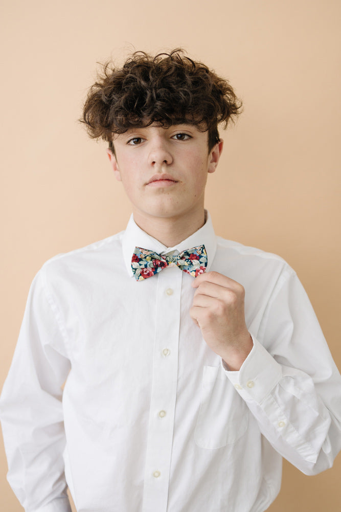 Mardi pre-tied bow tie worn with a white long sleeve shirt. 