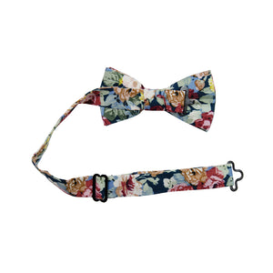 Mardi Pre-Tied Bow Tie with adjustable neck strap. Navy background with yellow, red, and cream flowers and blue leaves.