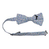 Misty Love Floral Pre-Tied Bow Tie with adjustable neck strap. White background with small blue, green, and pink flowers and mint green and blue leaves throughout.