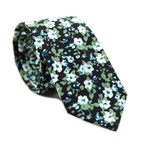 Morning Glory Skinny Tie. Black background with white flowers, blue flower center, and green leaves.