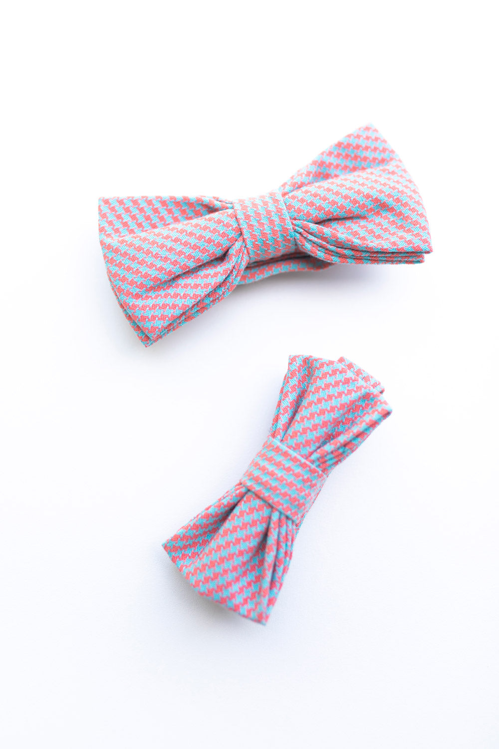 Opal Weave adult and kid size bow ties photographed together. 