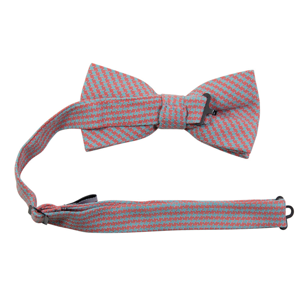 Opal Weave Pre-Tied Bow Tie with adjustable neck strap. Herringbone weave pattern of light blue and salmon color fabric. 