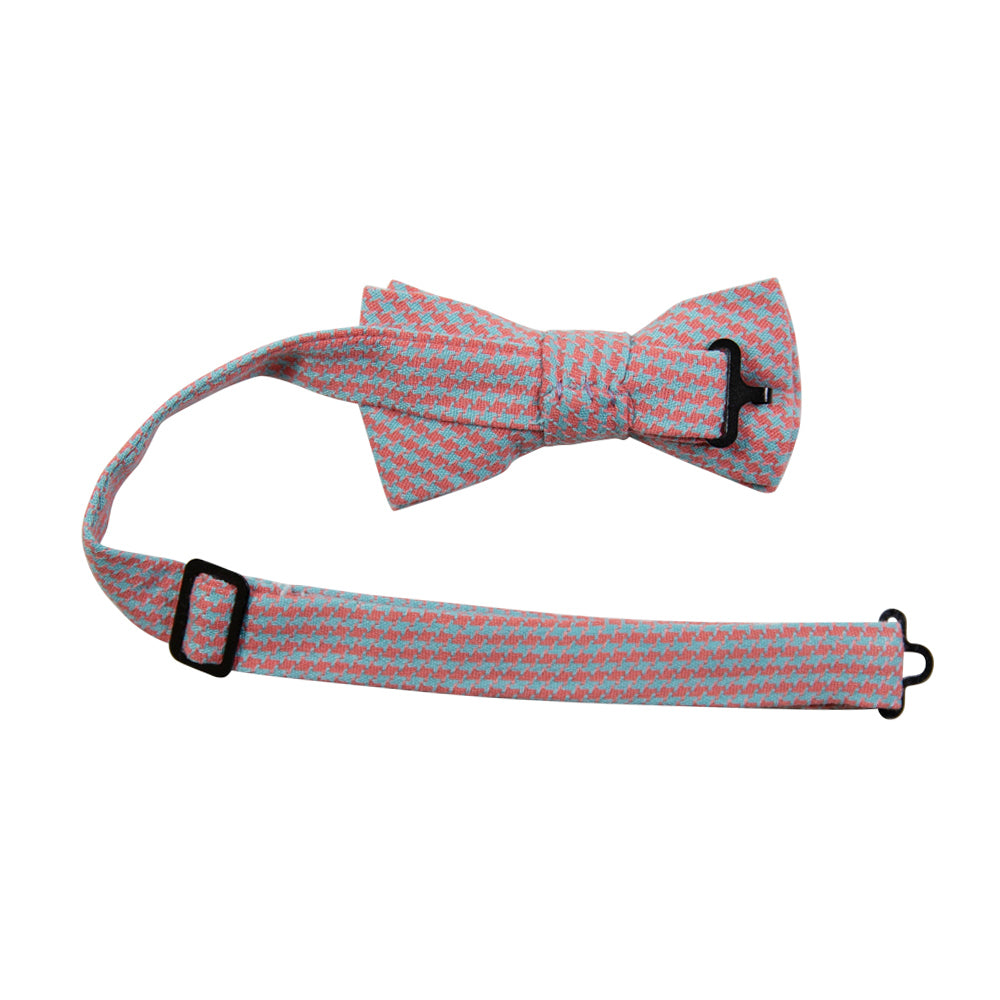 Opal Weave Pre-Tied Bow Tie with adjustable neck strap. Herringbone weave pattern of light blue and salmon color fabric. 