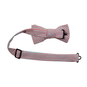 Opal Weave Pre-Tied Bow Tie with adjustable neck strap. Herringbone weave pattern of light blue and salmon color fabric. 
