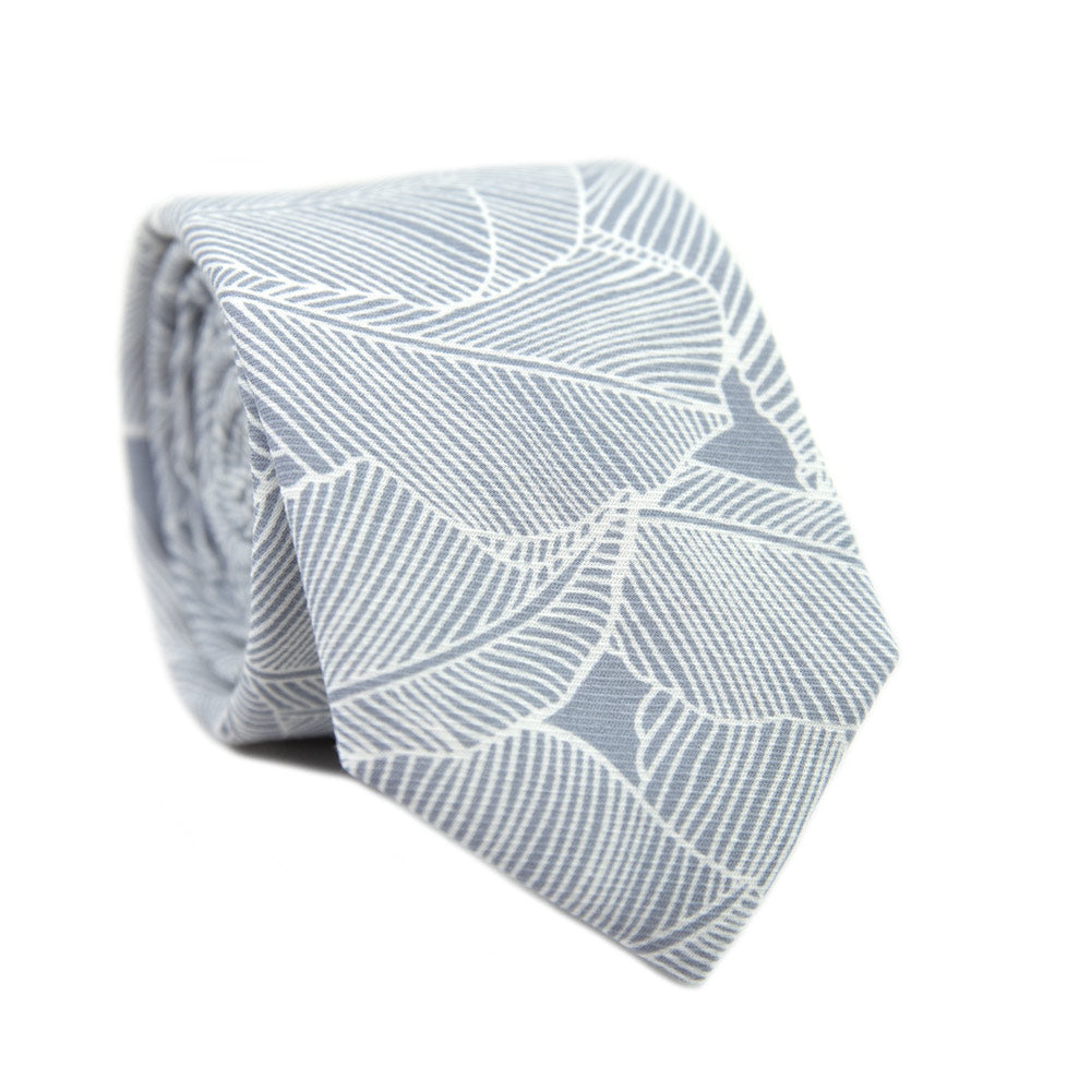 Palm Skinny Tie. Blue/gray background with white palm leaf pattern over entire tie.