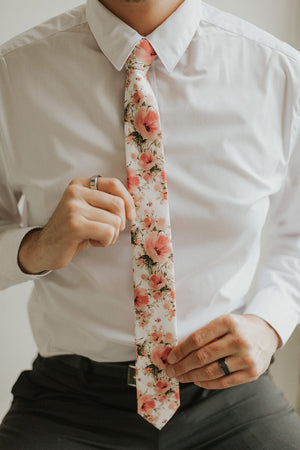 Peony tie worn with a white shirt, black belt and black pants.