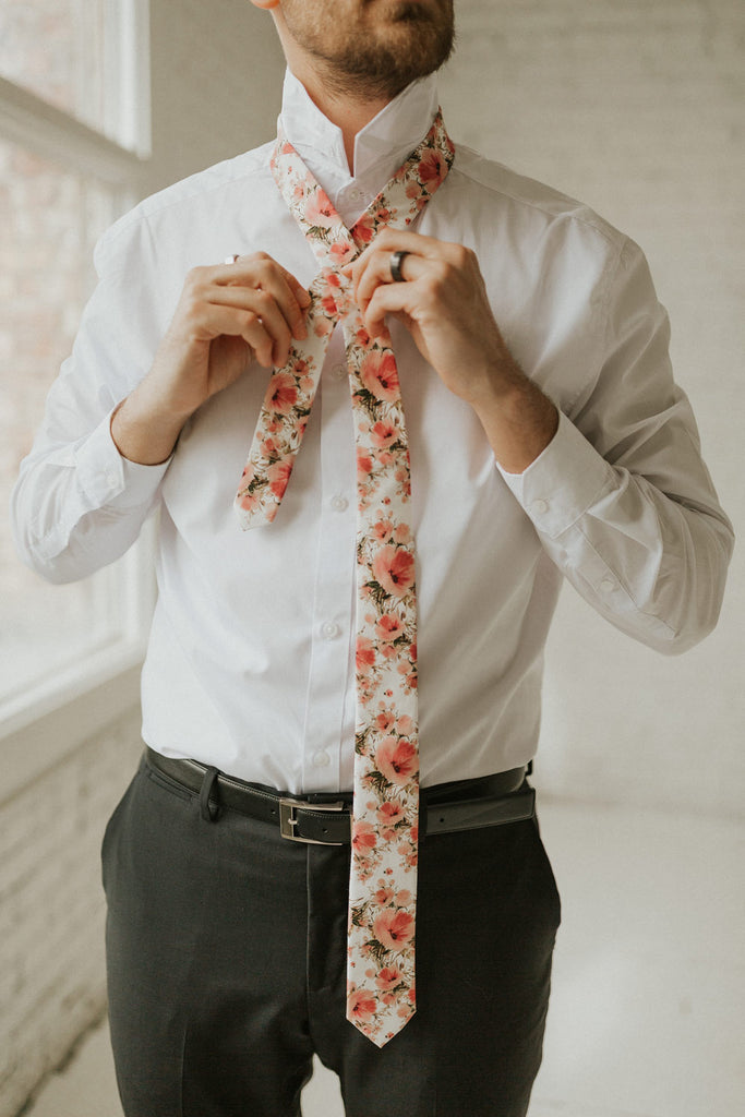 Peony tie worn with a white shirt, black belt and black pants.