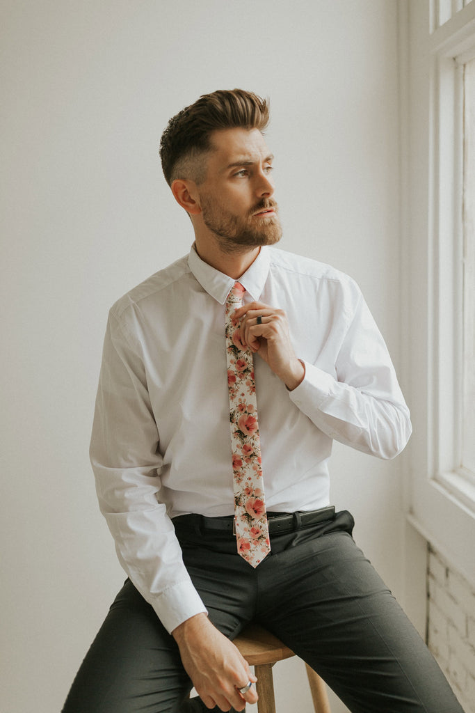 Peony tie worn with a white shirt, black belt and black pants.