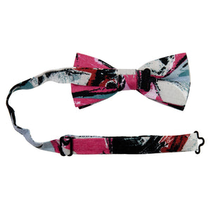 Picasso Pre-Tied Bow Tie with adjustable neck strap. Pink, red, black, white and green abstract pattern.