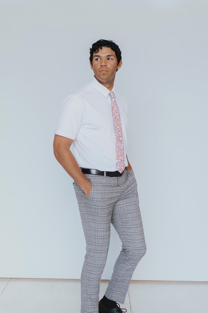 Pink Pansy Tie worn with a white shirt, black belt and gray plaid suit pants.