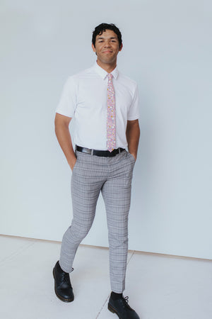 Pink Pansy Tie worn with a white shirt, black belt and gray plaid suit pants.