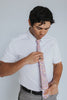 Pink Pansy Tie worn with a white shirt, black belt and gray plaid suit pants.