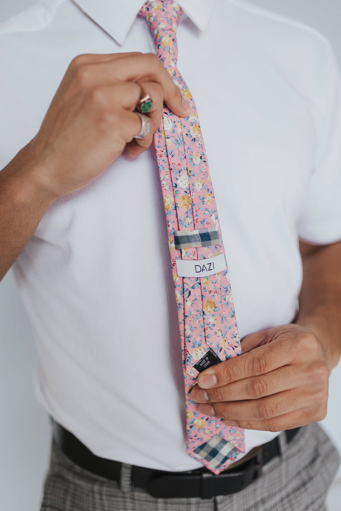 Pink Pansy Tie worn with a white shirt, black belt and gray plaid suit pants.