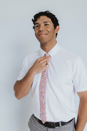 Pink Pansy Tie worn with a white shirt, black belt and gray plaid suit pants.