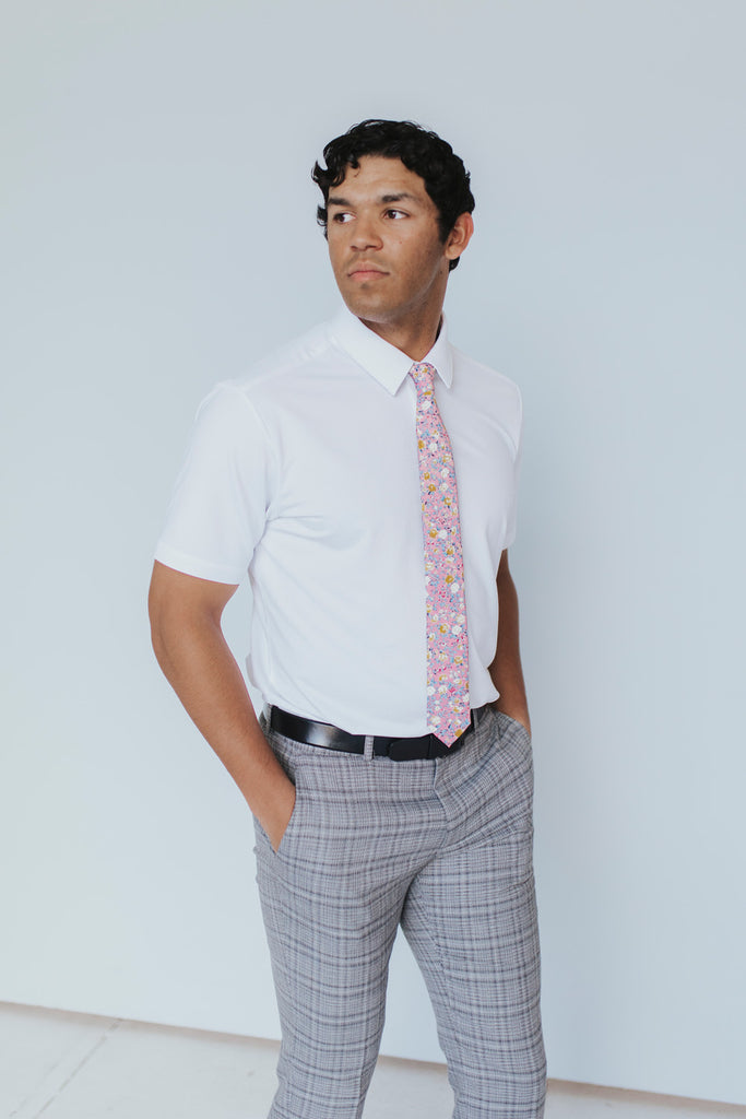 Pink Pansy Tie worn with a white shirt, black belt and gray plaid suit pants.