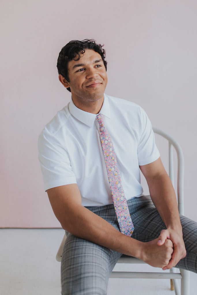 Pink Pansy Tie worn with a white shirt, black belt and gray plaid suit pants.