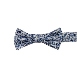 Powder Pre-Tied Bow Tie. White background with small navy and dusty blue flowers and black stems.