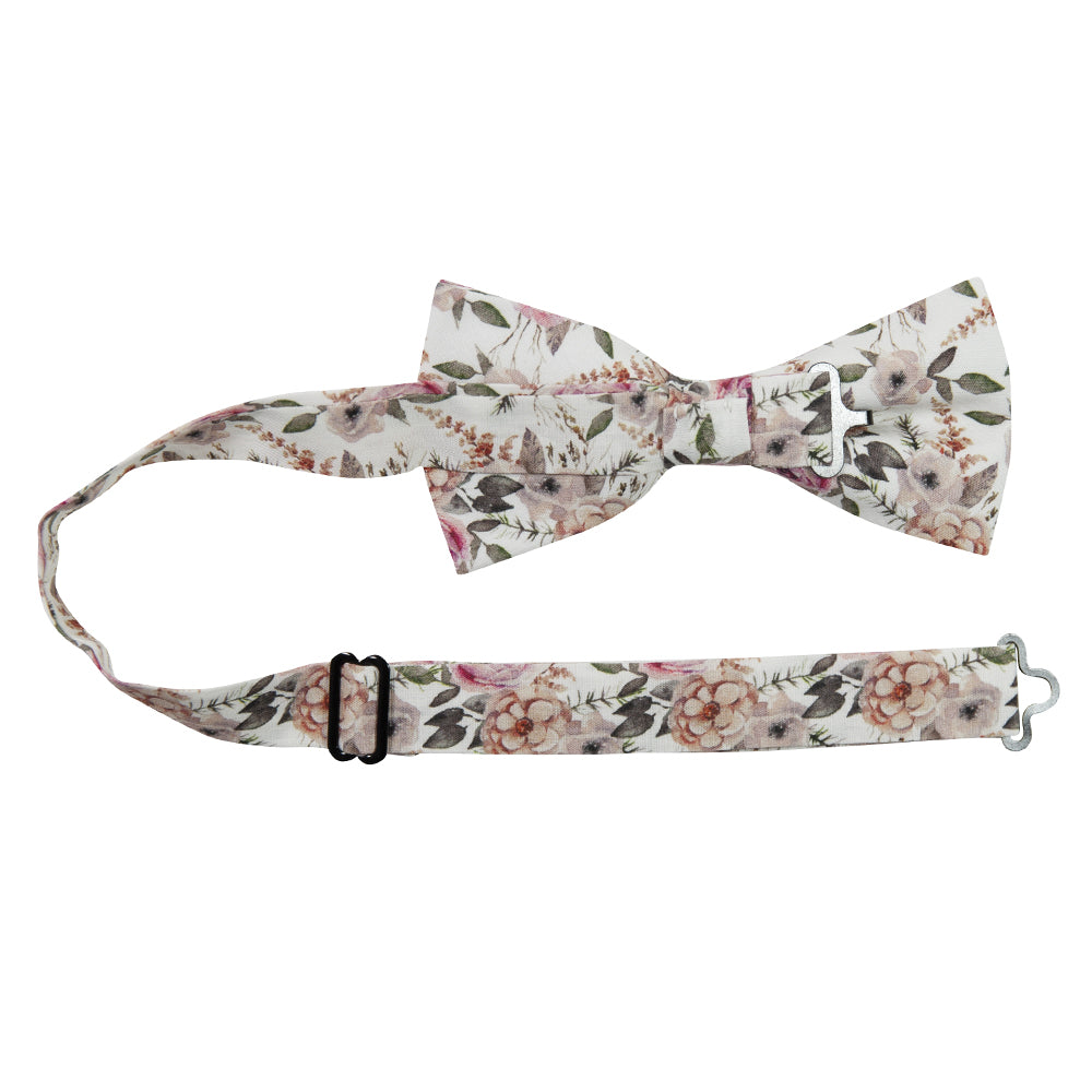 Quicksand Roses Pre-Tied Bow Tie with adjustable neck strap. White background with mauve, peach and blush pink flowers. Sage green leaves and branches throughout.