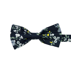 Rio Pre-Tied Bow Tie. Navy blue background with white and light blue flowers, green and yellow leaves and stems.