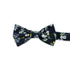 Rio Pre-Tied Bow Tie. Navy blue background with white and light blue flowers, green and yellow leaves and stems.