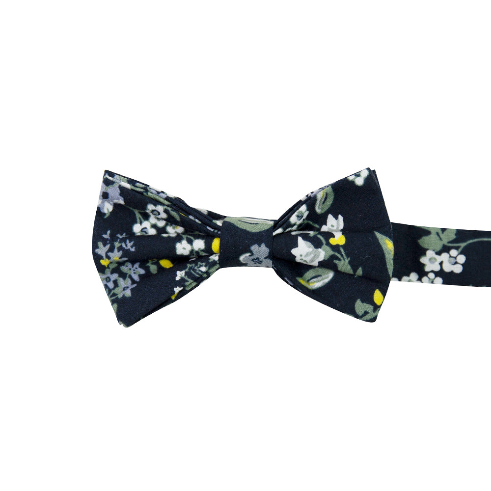 Rio Pre-Tied Bow Tie. Navy blue background with white and light blue flowers, green and yellow leaves and stems.