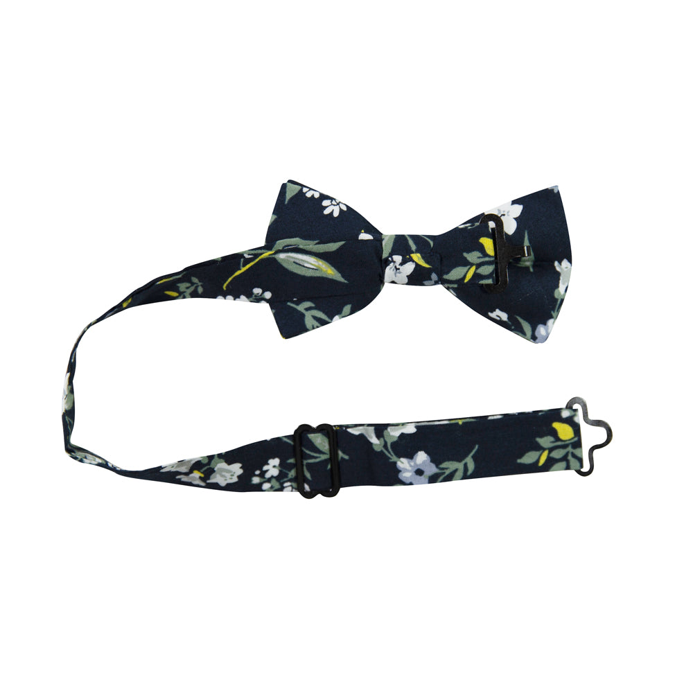 Rio Pre-Tied Bow Tie with adjustable neck strap. Navy blue background with white and light blue flowers, green and yellow leaves and stems.