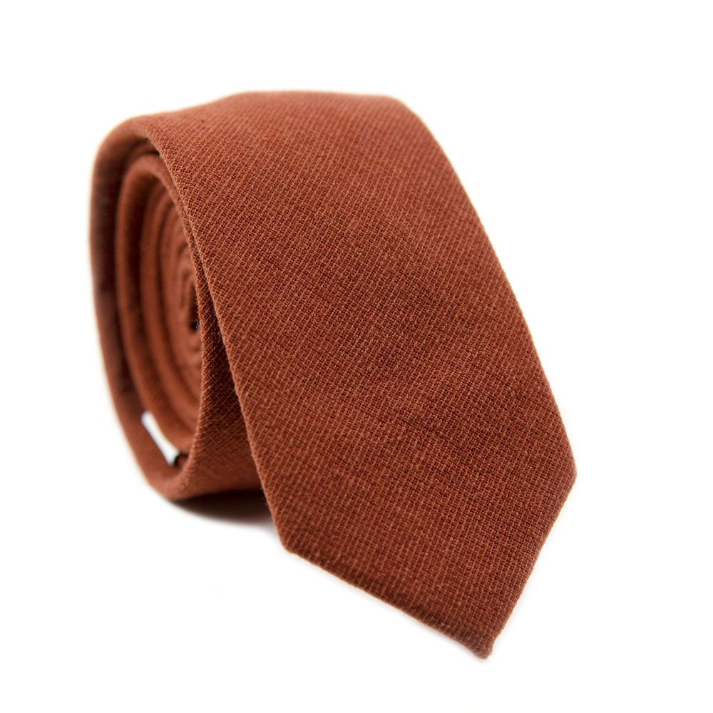 Rust Skinny Tie. Solid burnt red/orange textured fabric.