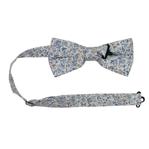 Scorpion Grass Floral Pre-Tied Bow Tie with adjustable neck strap. White background with small dusty blue and tan flowers throughout.