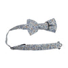 Scorpion Grass Floral Pre-Tied Bow Tie with adjustable neck strap. White background with small dusty blue and tan flowers throughout.
