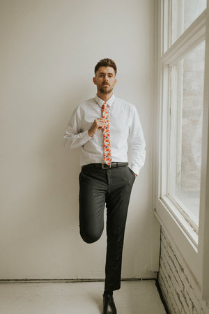 Silent Love tie worn with a white shirt, black belt and black pants.