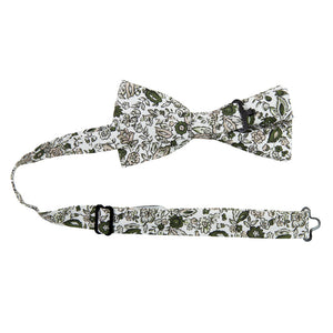 Silhouette Pre-Tied Bow Tie with Adjustable Neck Strap. White background with gray, black and light tan flowers and leaves.