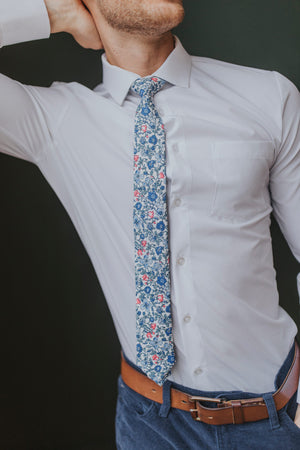Spring Bloom tie worn with a white shirt, brown belt and navy blue pants.