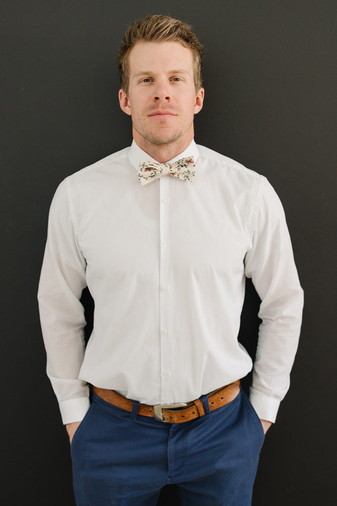 Sugar Blossom Pre-Tied Bow Tie worn with a white shirt, brown belt and blue pants. 