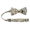 Sugar Blossom Pre-Tied Bow Tie with Adjustable Neck Strap. Cream background with medium size mauve flowers, small dusty blue flowers, and sage green leaves.
