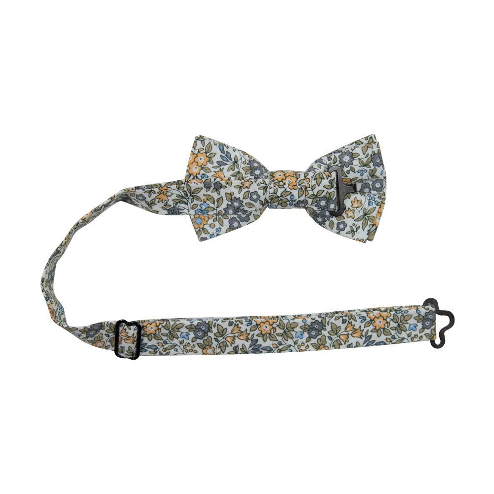 Sunny Meadow Floral Pre-Tied Bow Tie with adjustable neck strap. White background with yellow and gray flowers and tan leaves throughout.